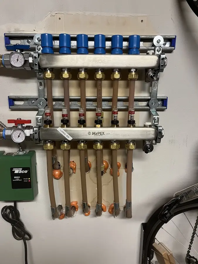 Plumber performing Water Heater Repair at a residential property in Howards Grove